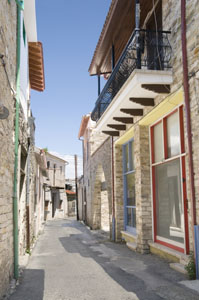 A narrow street in Lefkara Village, Cyprus. Balcony and a bright